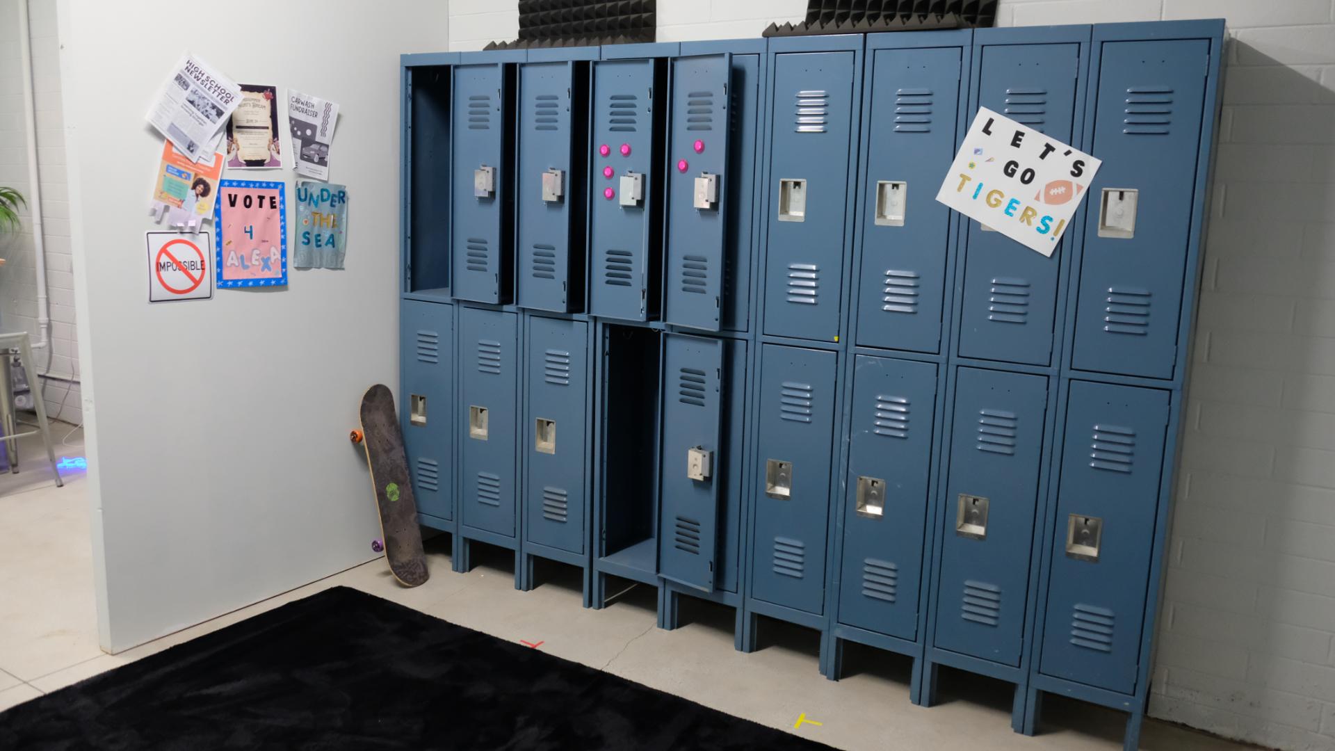 Typical high school locker hallway styled for a film scene, featuring bright lockers and polished floors
