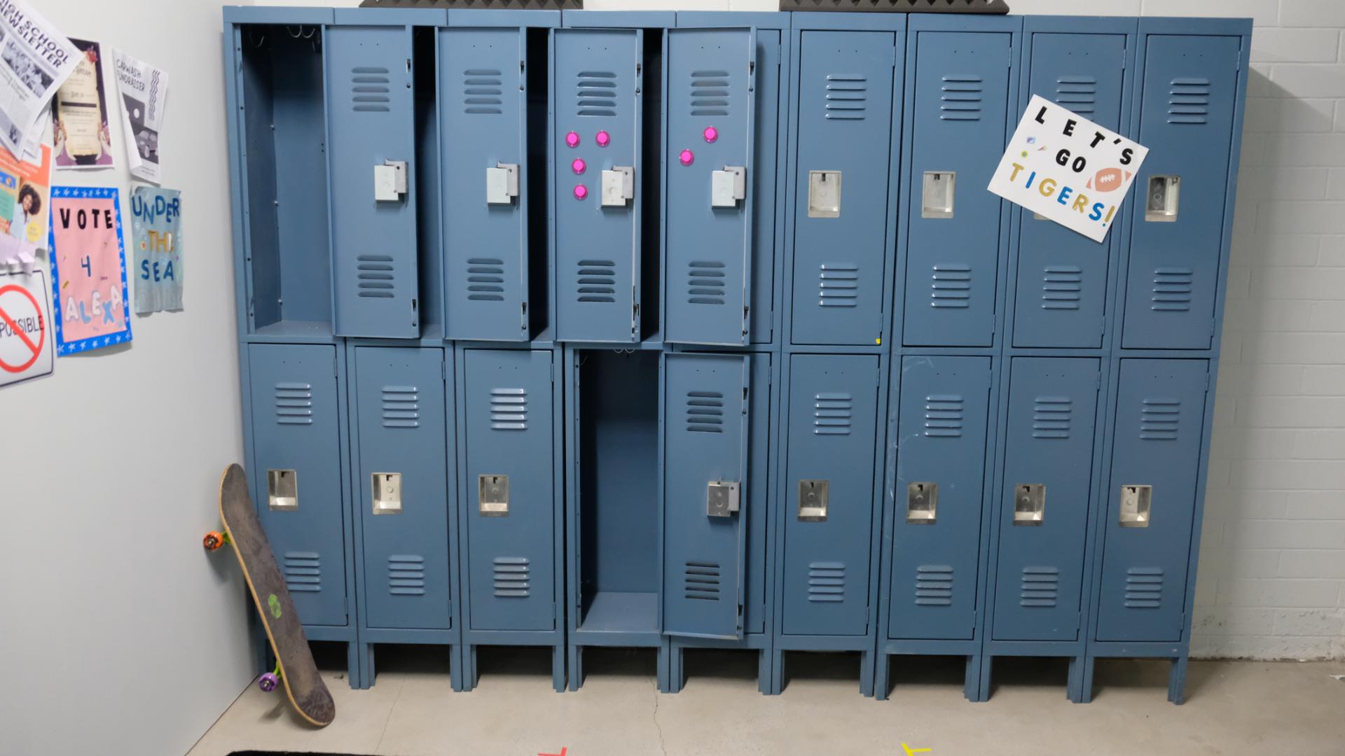 School locker hallway prepared for filming with controlled lighting and clear sightlines.