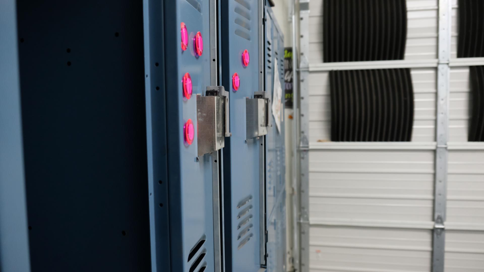 Moody school hallway lined with lockers, creating a tense, cinematic atmosphere.