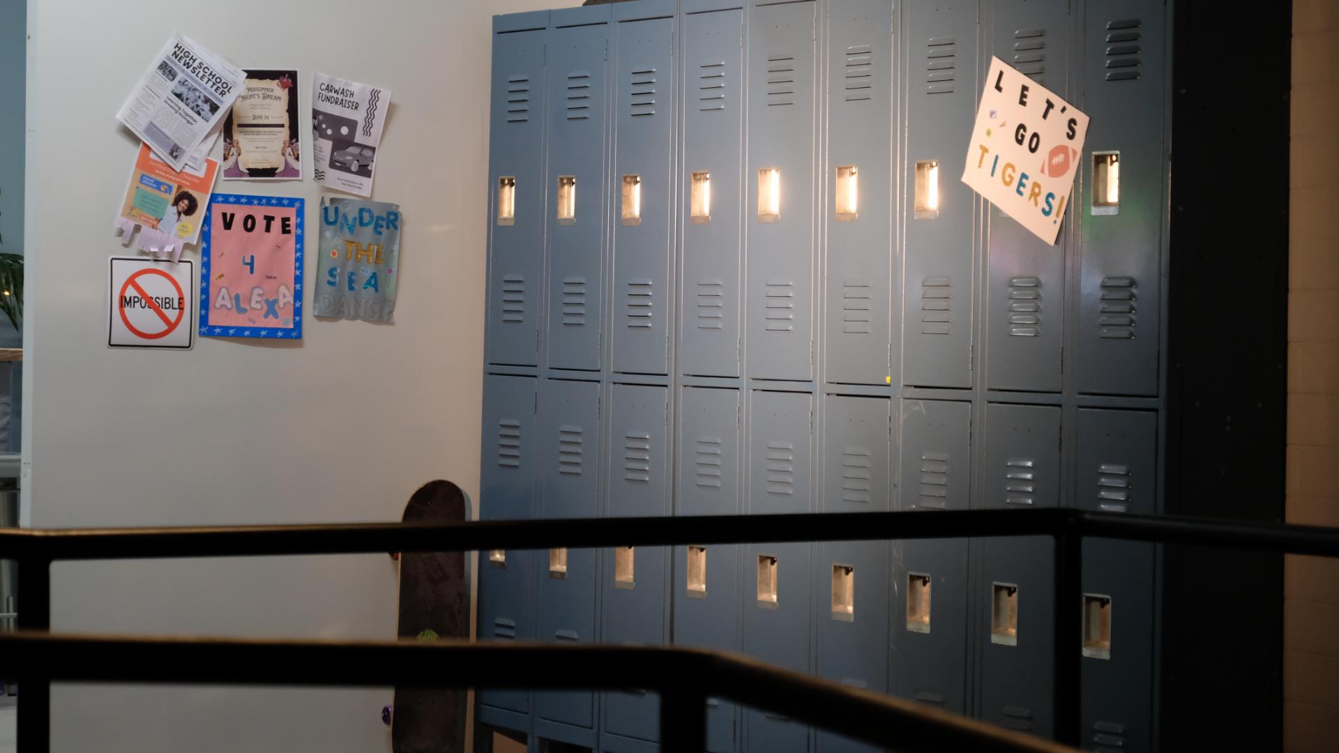 High school locker hallway with rows of lockers and overhead lighting prepared for a film scene.